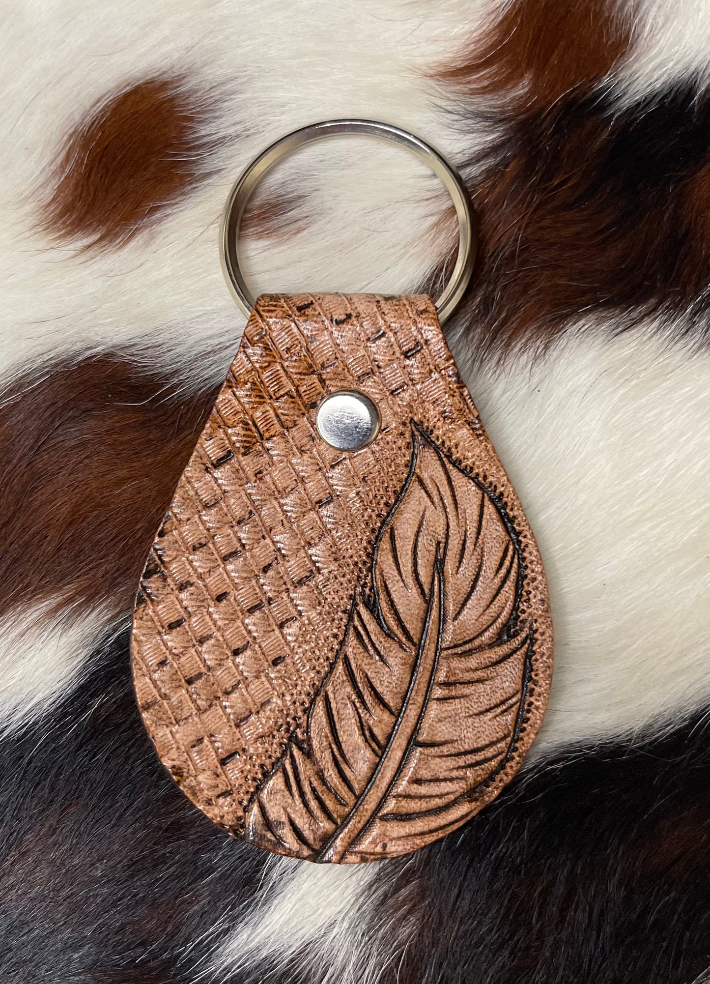Leather tooled feather keychain
